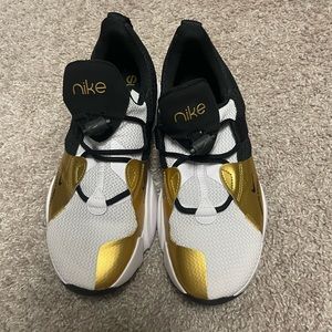 Gold, black and white Nikes